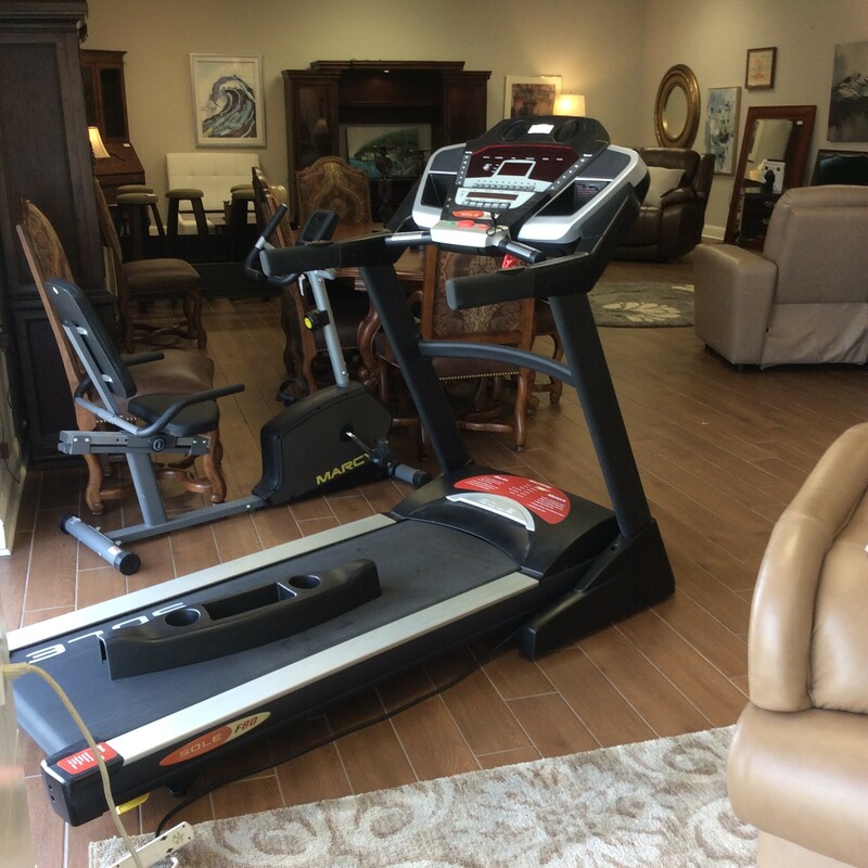 This is a SOLE Treadmill. This treadmill includes, a whisper deck, a whisper drive, 3.0 HP, Fans, aux cord doc, easy folding deck and 2 cup holders.