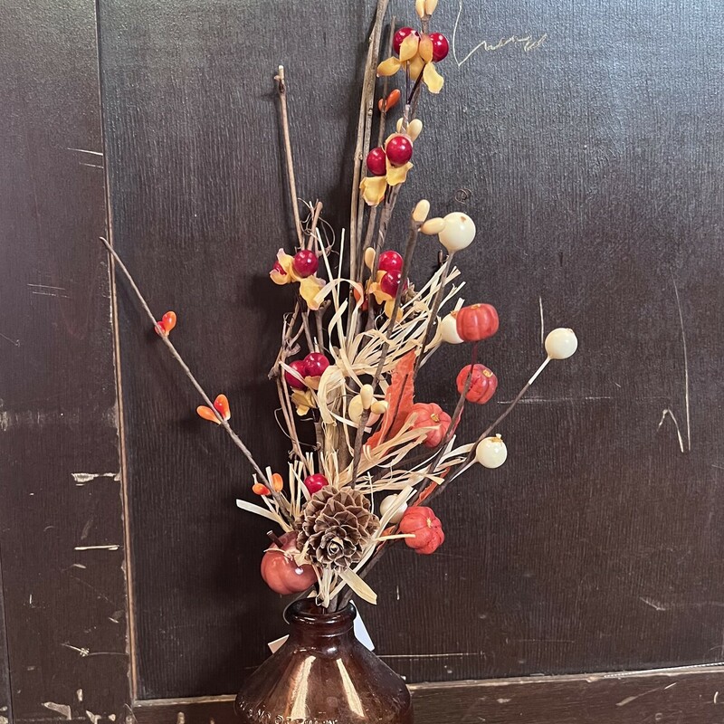Harvest Farmfield Stem features a mix of ivory berries;  autumn colored pips; bittersweet; foam pumpkins; pine cones; orange fabric leaves and dried hay. Simply place in any vase; pitcher or can for an easy fall display that looks great all season.  Stem measures 14 inches high