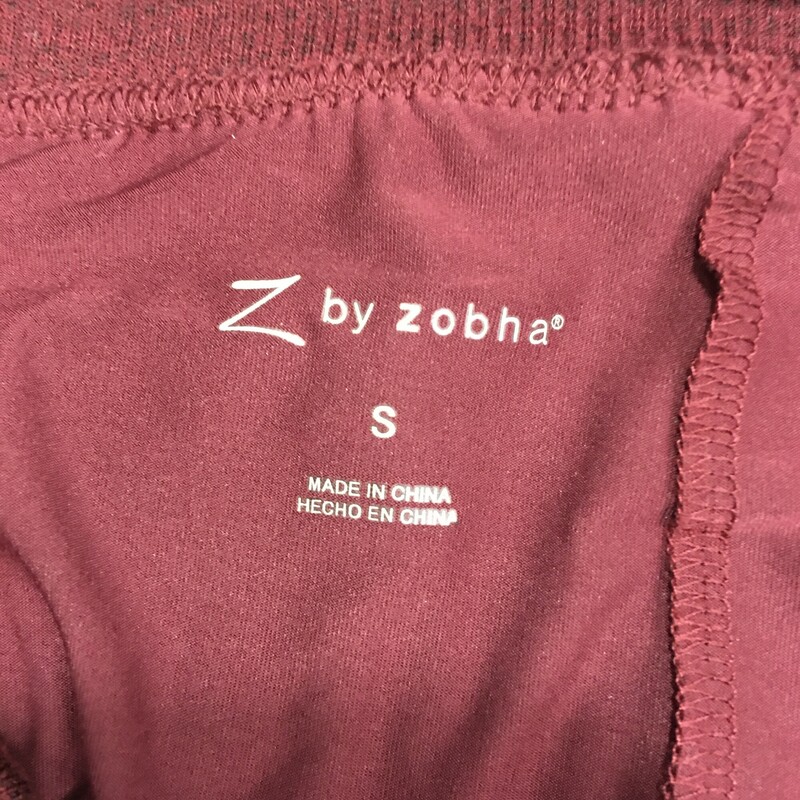 Z By Zohba Skort, Maroon, Womens Size: Small<br />
Z by Zohba Skort maroon, covered wide tooth zip back Pocket, light knit w under boyshorts, lightweight, nice condition. Skort: 96%Polyester,4% Spandex , shorts: 91%Polyester,8% Spandex<br />
Machine wash cold gentle like colors, no bleach, tumble dry low.do not dry clean do not wring dry.<br />
<br />
7.9 oz