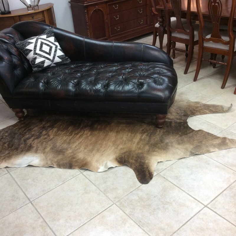 This is a beautiful Tan and Brown Brindle large Cow Hide Rug.