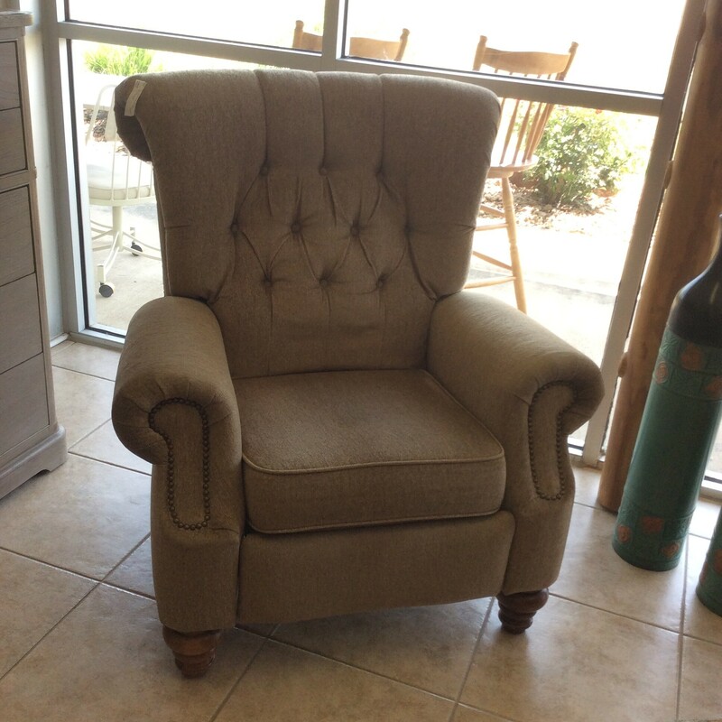 This is a Flexsteel tan & ivory recliner. This recliner is tuffed and has nailhead trim.