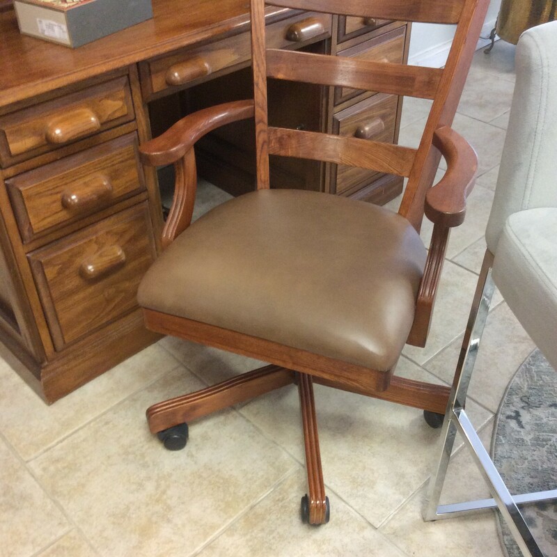 This is a wood office chair with a light stain and leather seat. This chair also swirels and has rollers.