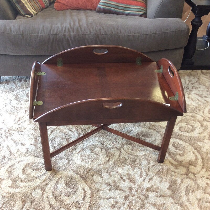 This is a Hickory Chair Company Tray Type Coffee Table. This coffee table has a nice dark stain and folding sides.