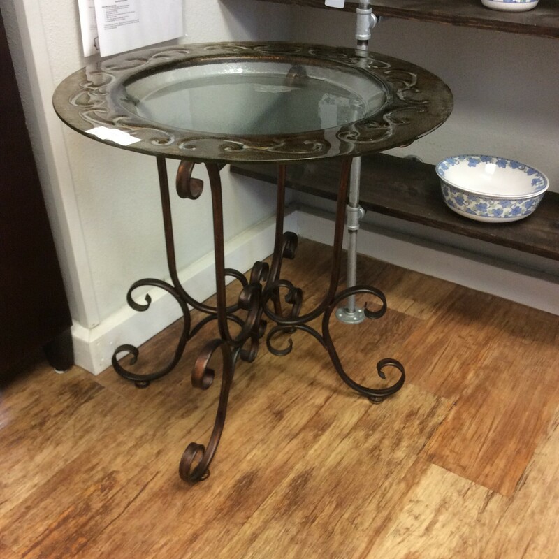 This beautiful glass and iron birdbath will add an elegant touch to any garden setting.