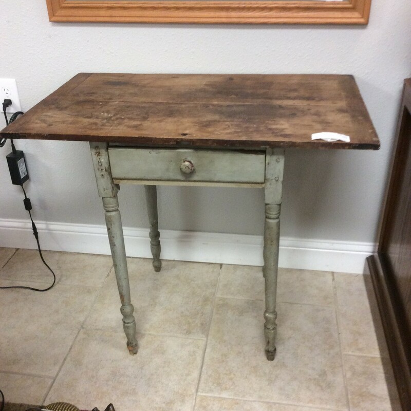 This charming rustic antique table has a center drawer and distressed painted base. Could be used in multiple settings.