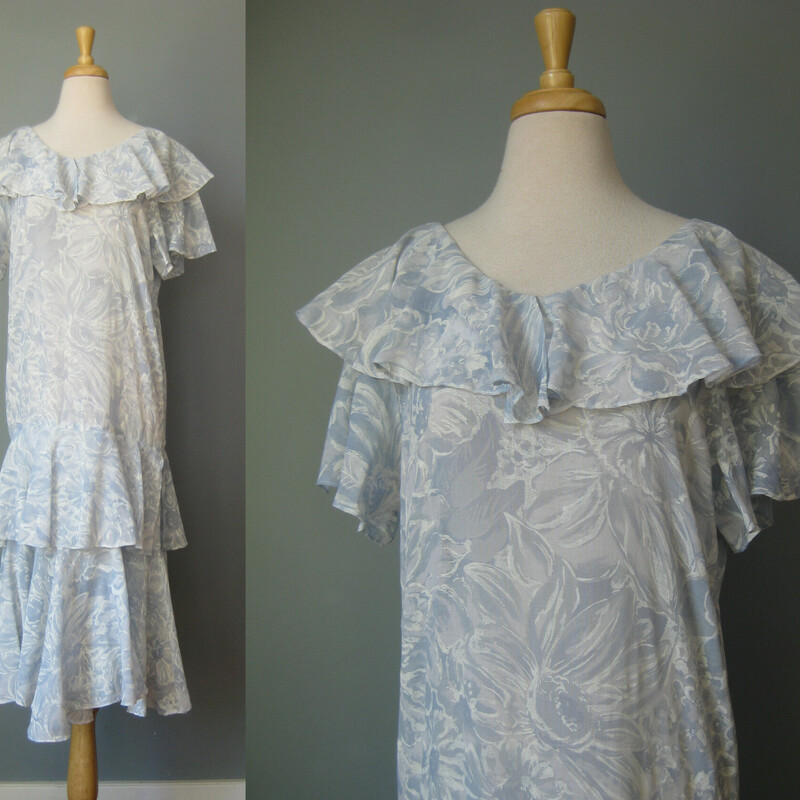Vtg Starlo Flounced, Blue, Size: 8
Extra lightweight blue dropped waist summer dress with a flouncy cape collar and fluttery sleeves, more flounces down below.  Pale blue with swirly and subtle white floral pattern, it gives the impression of a soft summer sky.

This dress was made by Star Lo

The whole effect is very romantic, easy and feminine.
You could wear this for a walk in the garden or dress it up for a  party.

No closures, goes on over the head.
Unlined, the strategic placement of the flounces means no slip necessary.

Flat measurements, pls double where appropriate:
Shoulder to shoulder: 16.5
armpit to armpit: 20
waist: 19
hip: 19.25
length: about 44

thanks for looking!
#43110