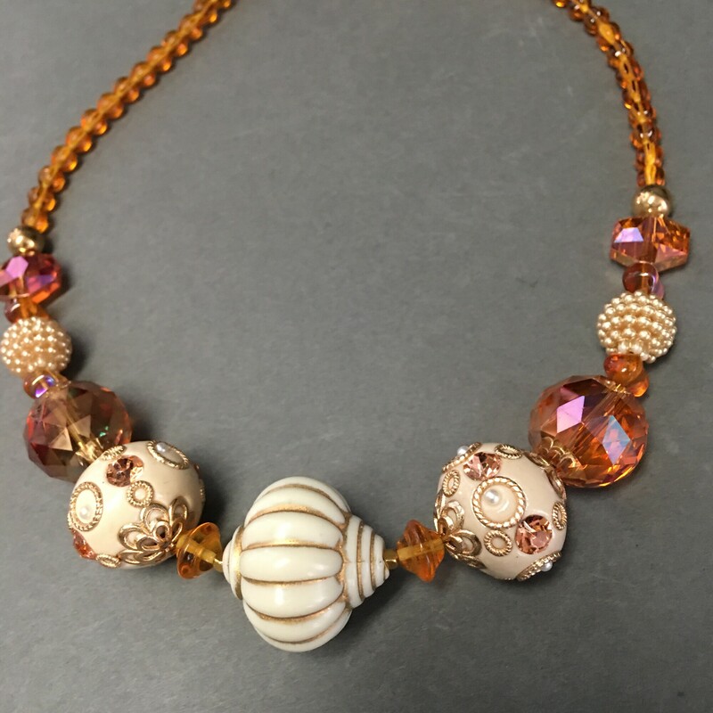 Enamel,Amber Glass, Ochre, Size: Necklace<br />
 Necklace. Enamel focus beads, Amber<br />
glass, and gold beads. $60.00<br />
Hand made by Eileen Settle