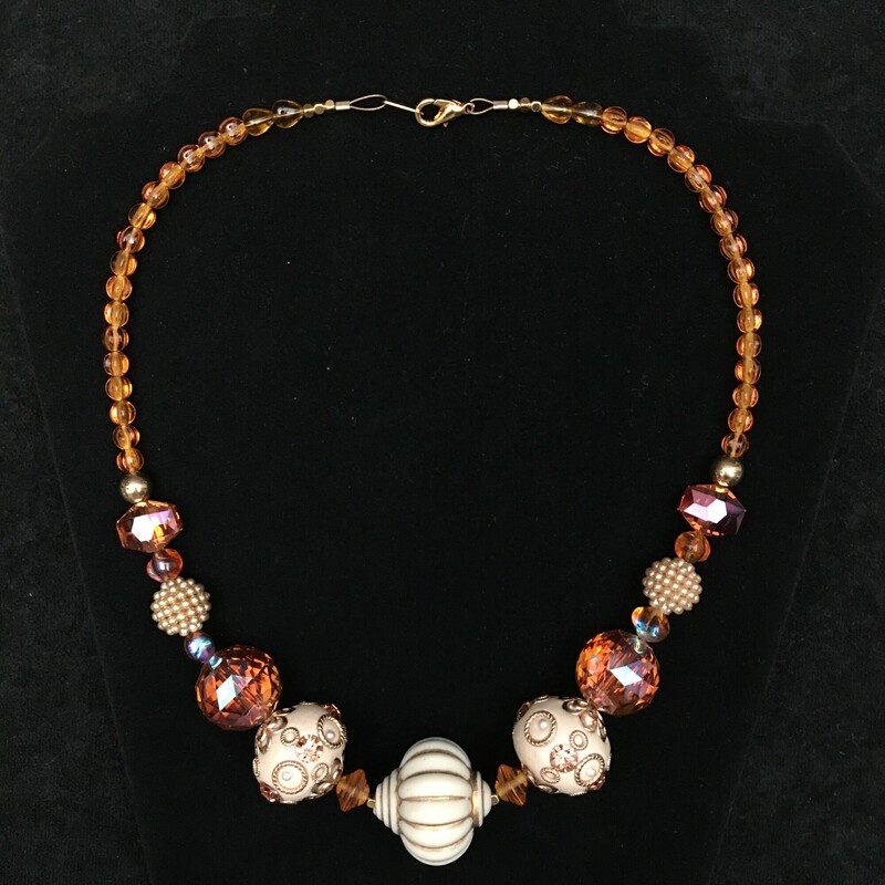 Enamel,Amber Glass, Ochre, Size: Necklace<br />
 Necklace. Enamel focus beads, Amber<br />
glass, and gold beads. $60.00<br />
Hand made by Eileen Settle