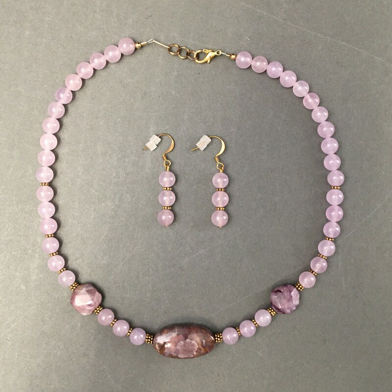 .Necklace 18\"-20\", Drop pierced earrings
Lavender fluorite, Charoite stones, gold
metal spacers. Sold as set $ $49.00
Handmade by Eileen Settle