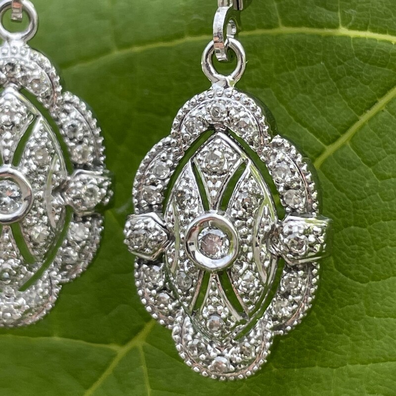 Elegant Edwardian Style Diamond Earrings
Has 0.26 Carats Of Round Brilliant Diamonds
Set In 14k White Gold