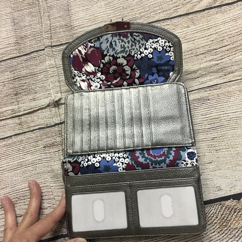 New Vera Bradley Wrislet, Silver, very spacious inside, multiple slots for cards, etc., snap closure on front, zipper closure on back