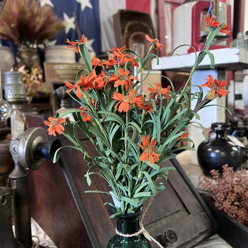 The Mini Orange Daisy Bush is a perfect touch to your fall decor.  It has pretty silk orange daisies and soft foam leaves on a brown floral stem.  This floral measures 18 inches high