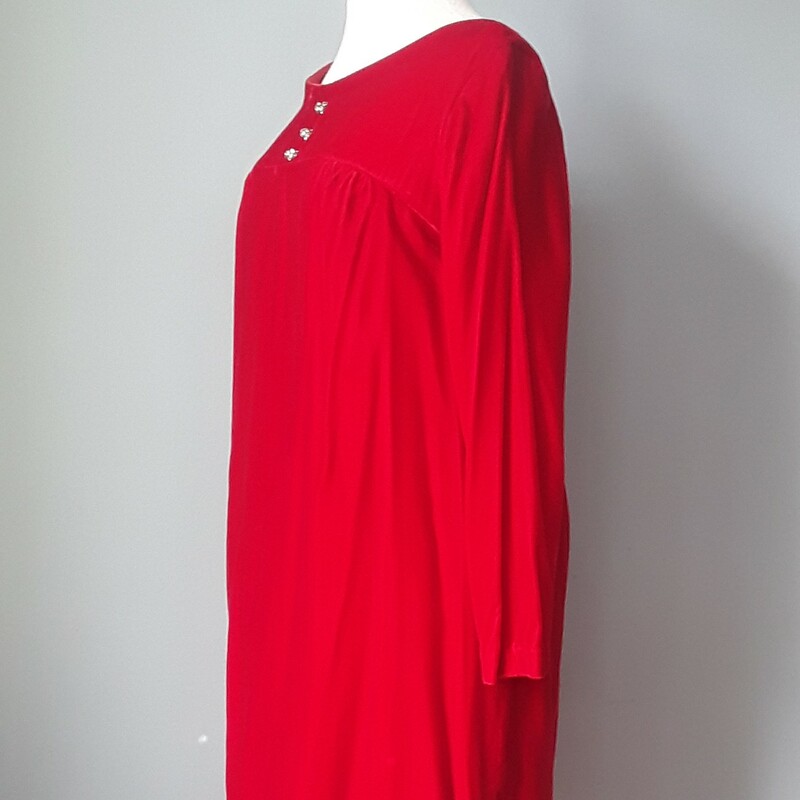 Sweet shift dress in red velvet.  It has long sleeves and shift silhouette.<br />
The bodice has a short yolk and the lower part of the dress is gathered into the bottom of that.<br />
Decorated with three (non functioning) rhinestone ball buttons.<br />
The long sleeves have slits at the ends<br />
lined.<br />
Center back metal zipper, not tags, possibly home made<br />
<br />
Here are the flat measurements, please double where appropriate:<br />
Armpit to armpit: 18.25<br />
Shoulder to shoulder: 16.5<br />
Waist: 20.5<br />
Hip: 21<br />
Length: 37<br />
Underarm Sleeve Seam Length: 16.5<br />
Thank you for looking.<br />
#43214