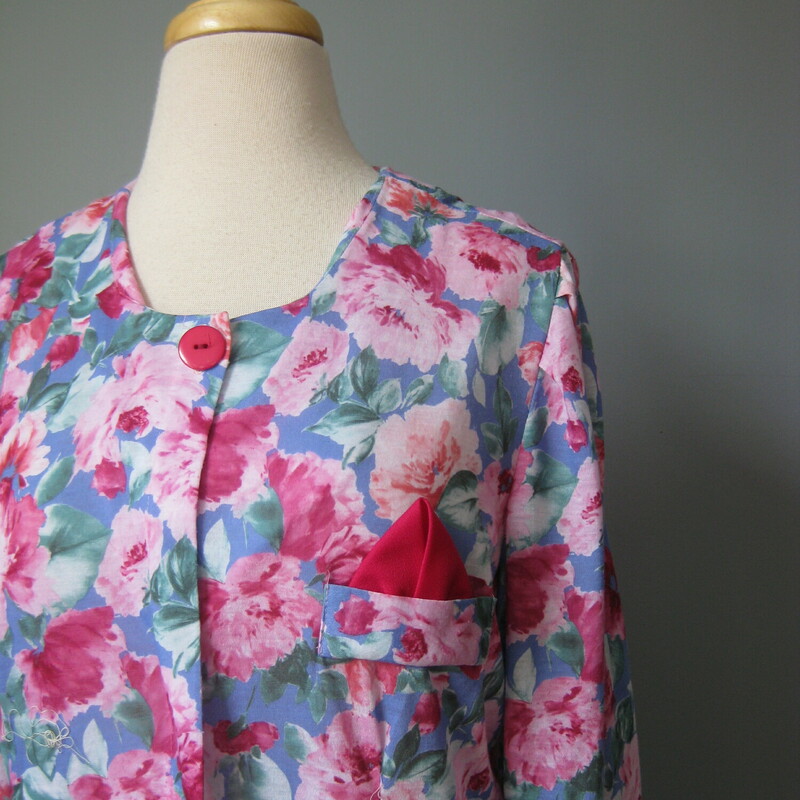Pretty floral dress from the early 80s or late 70s<br />
Pinks and blue floral pattern<br />
Dropped waist with pleated skirt<br />
Polyester knit<br />
Cute faux chest pocket with attached pocket square<br />
Made in the USA<br />
One button at the neck<br />
Long sleeves<br />
<br />
by T & F<br />
Flat measurements:<br />
Shoulder to shoulder: 17<br />
armpit to armpit: 21.25<br />
waist: 18.75<br />
hip: 22<br />
length: 38<br />
<br />
excellent condition<br />
thanks for looking!<br />
#43158