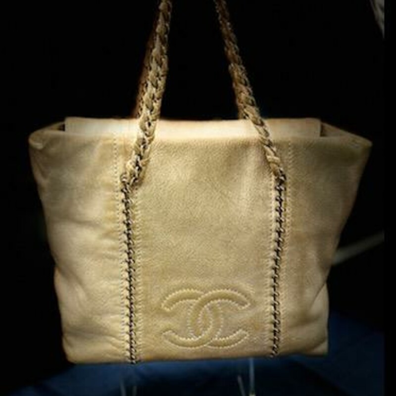 CHANEL
Chanel Metallic Gold Leather Medium Chain Tote
Crafted from the modern woman, the Chanel tote is ideal for a city girl who commutes daily, loves shopping, and travels often. Made from leather, the creation is highlighted with gold-tone hardware and dual handles. The spacious interior is secured by a zip fastening that makes it a fashion-meets-function accessory.
Length: 31 cm
Width: 13.5 cm
Height:  27 cm
Handle Drop:  18 cm
Hardware:  gold Tone
Exterior Material: Leather
Interior Material:  Leather
Origin:  Italy
Production Year:  2005-2006
This bag is in gently used condition.
Comes with the CERTIFICATE of AUTHENTICITY
The Luxury Closet Resale is selling this bag in similar condition for 2215.00