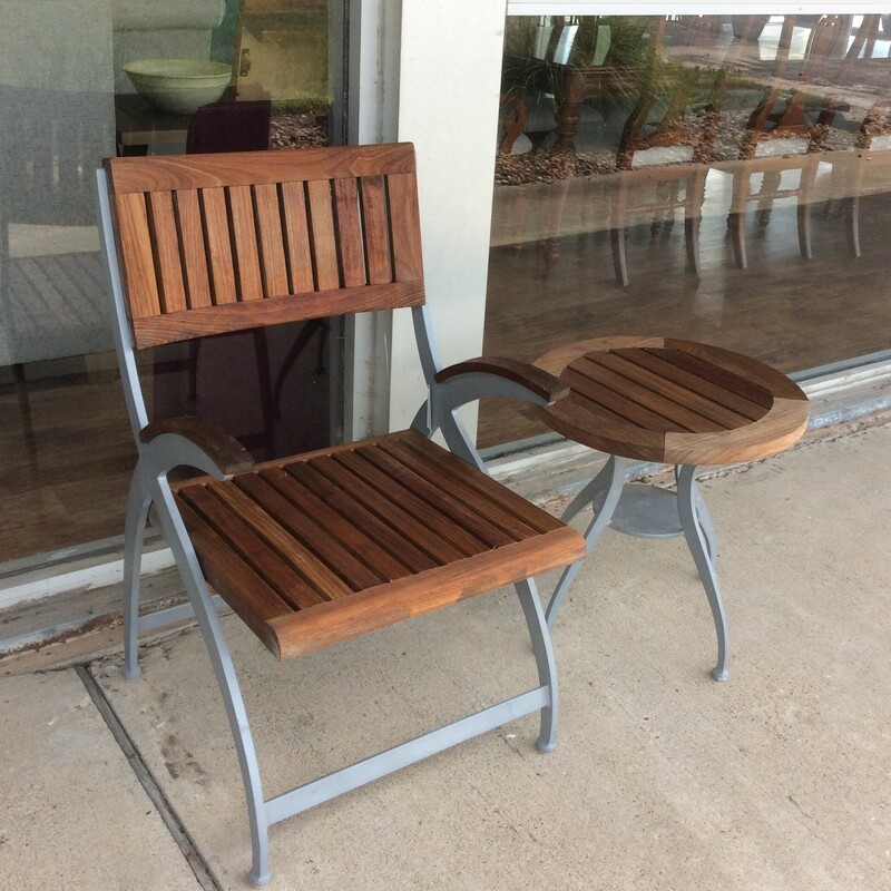This is a beautiful Teakwood chair and side table with metal arms and legs.