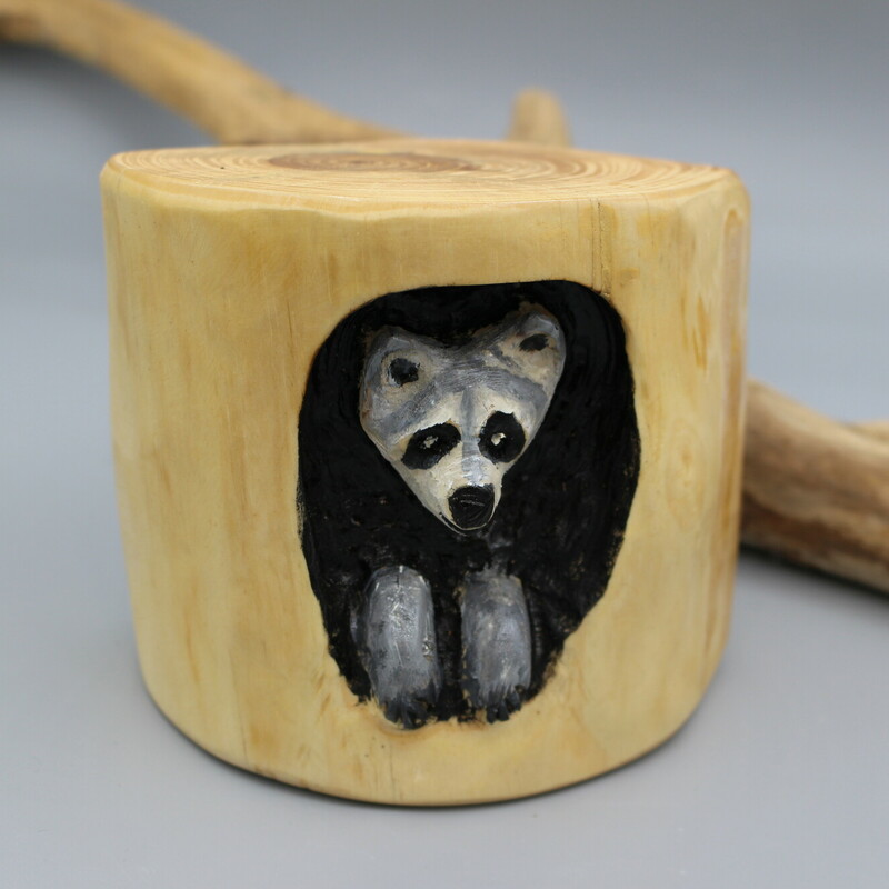 Carved WD Racoon In Log