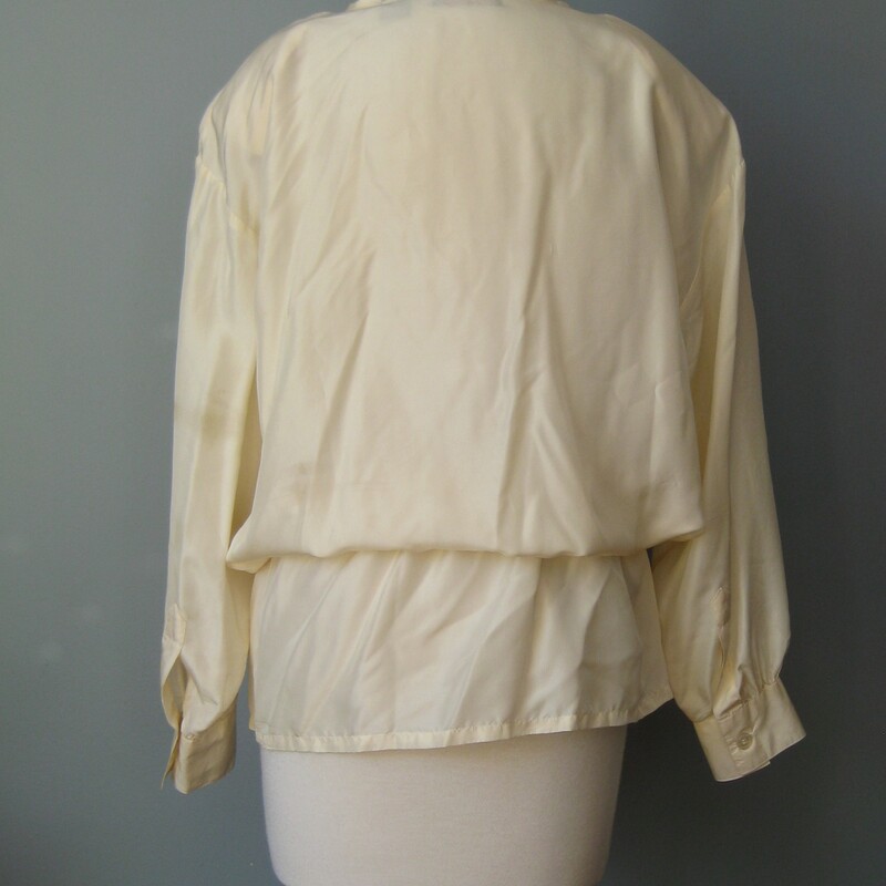 Vtg Quarters Silk, Ivory, Size: Medium<br />
<br />
romantic cottage-y silk blouse from the lates 90s.<br />
It's a bit longer than usual and has a drawstring built into the waist to you can create a pretty blouson effect.<br />
high quality lightweight with front buttons and long button cuff sleeves<br />
<br />
CREAM / IVORY white not bright white.<br />
<br />
Marked Size M, relaxed fit will fit up to a modern size large<br />
flat measurements:<br />
shoulder to shoulder: 22<br />
armpit to armpit: 22<br />
length: 32.25<br />
underarm sleeve seam: 17<br />
waist: 21.5<br />
<br />
thanks for looking!<br />
#43247