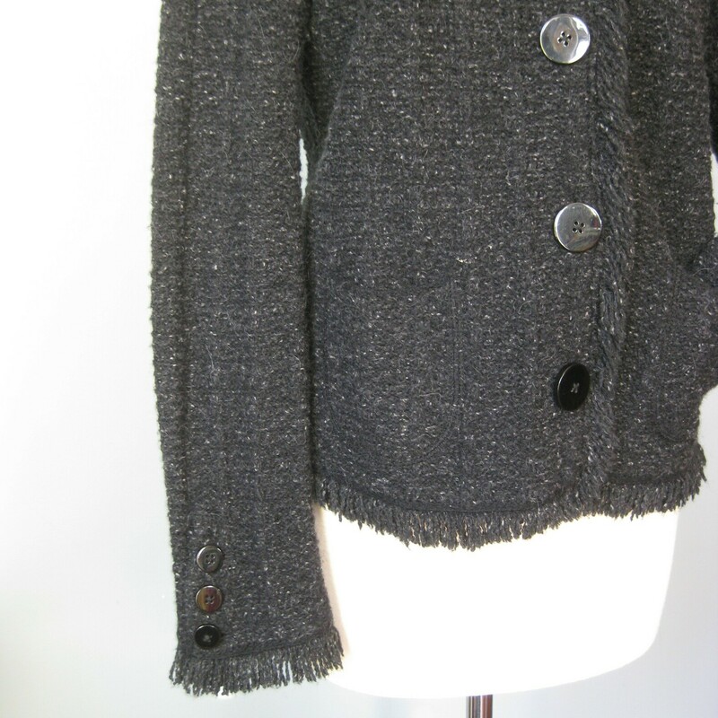Tweed Cardigain Wool, Black, Size: Medium<br />
You are professional, classic and expensive looking in this nice warm cardigan by an unknown maker in a wool blend tweed that includes alpaca<br />
The colors are black gray and white<br />
Classic styling<br />
Works as a jacket or a top layer cardigan<br />
fringed edges<br />
button closure<br />
working pockets<br />
super comfy<br />
Excellent condition<br />
plenty of stretch, unlined<br />
Here are the flat measurements, please double where appropriate:<br />
<br />
Armpit to armpit: 19<br />
width at hem when buttoned: 20<br />
underarm sleeve seam: 19<br />
Overall length: 24<br />
<br />
Thanks for looking!<br />
#42041