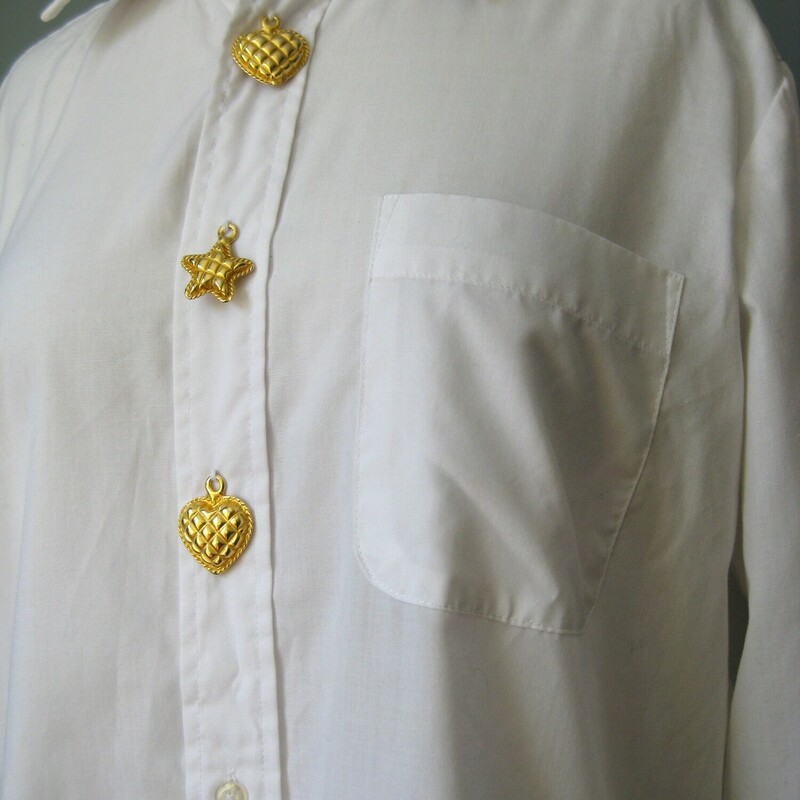 Vtg Cache, Wh/Gold, Size: Medium<br />
<br />
This is a fun white blouse with a little something extra.<br />
By Cache ( Gold Label!)<br />
White cotton poly blend<br />
Embellished with three substantial gold tone metal charms on the button placket.<br />
Two hearts and a star in the middle.<br />
Made in Korea<br />
Marked size M<br />
Flat measurements:<br />
shoulder to shoulder: 16.5<br />
armpit to armpit: 22.5<br />
width at hem: 21.75<br />
underarm sleeve seam length: 19<br />
length : 31.5<br />
Excellent condition!<br />
<br />
thanks for looking<br />
#43165