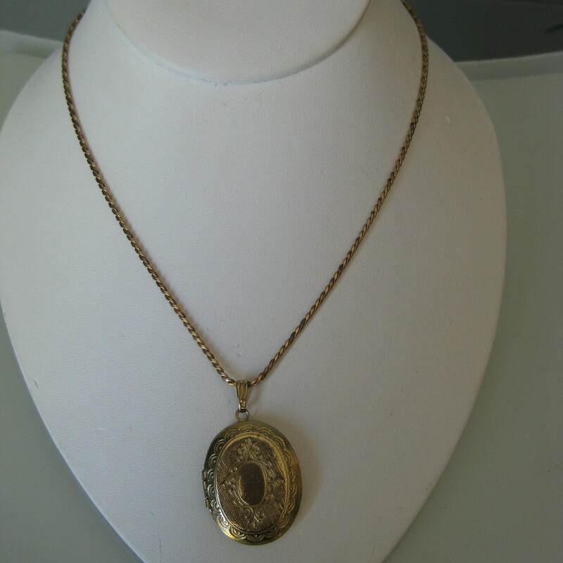 Gold Locket Gold Fill Ch, None, Size: None<br />
<br />
Nice sized locket pendant necklace to keep tiny pictures of your special ones close to your heart.<br />
Super gift for mothers and grandmothers.  Pretty etching on the front<br />
<br />
Gold-tone metal locket and chain<br />
The spring loop on the chain is marked 1/20 12 KT GF<br />
Stays closed nice and  firmly.<br />
Can hold two pictures<br />
<br />
Length of chain: 14.75<br />
Width of locket: 7/8 close , space for the pictures is about .5<br />
<br />
Thanks for looking!<br />
<br />
#50979