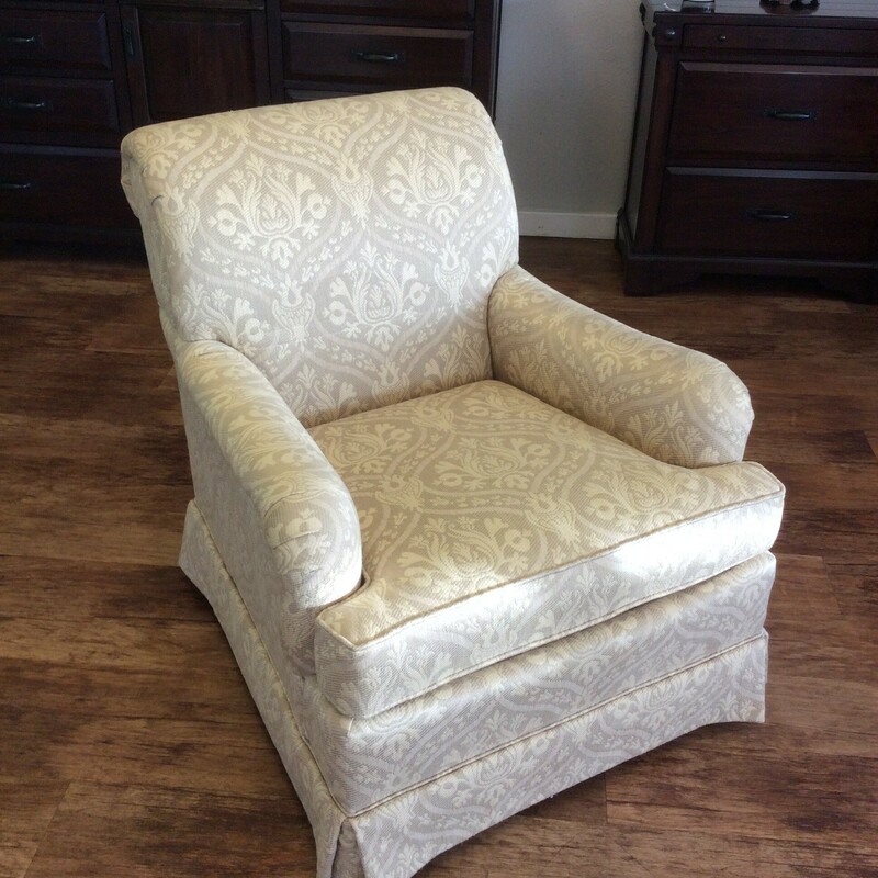 This is a beautiful cream and ivory skirted Drexel chair with a beautiful pattern.