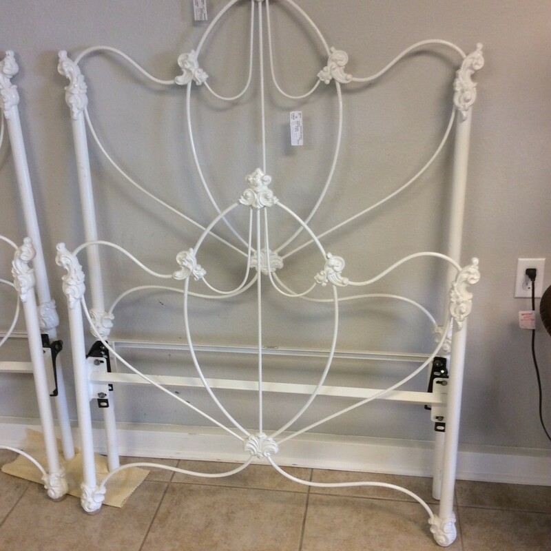 This is a beautiful white, metal twin bed. This bed comes with rails.
