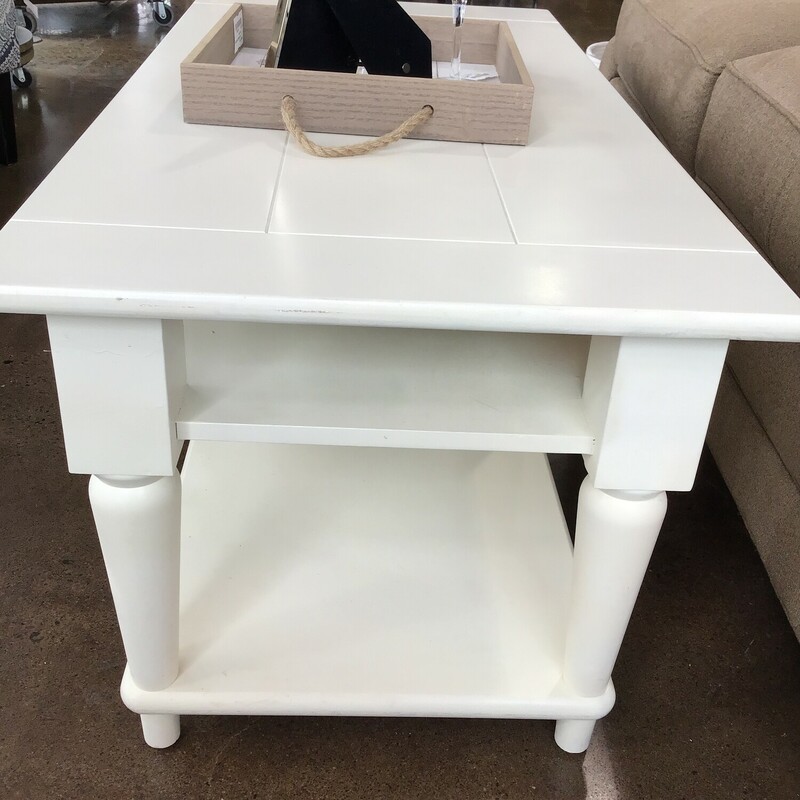 Rectangular coffee table
Painted off white
Narrow shelf for books, magazines or remote
Lower spilt shelf for decor or a cat

Dimensions: 40x20x18