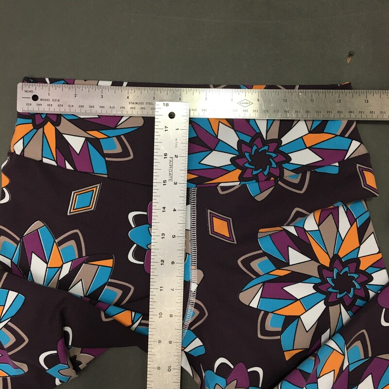 Pattern Leggings No Tags Size: Medium Dark Purple orange aqua and white geometric flower pattern. Heavy stretch fabric  with wide waist band.  Size runs small
8.5 oz