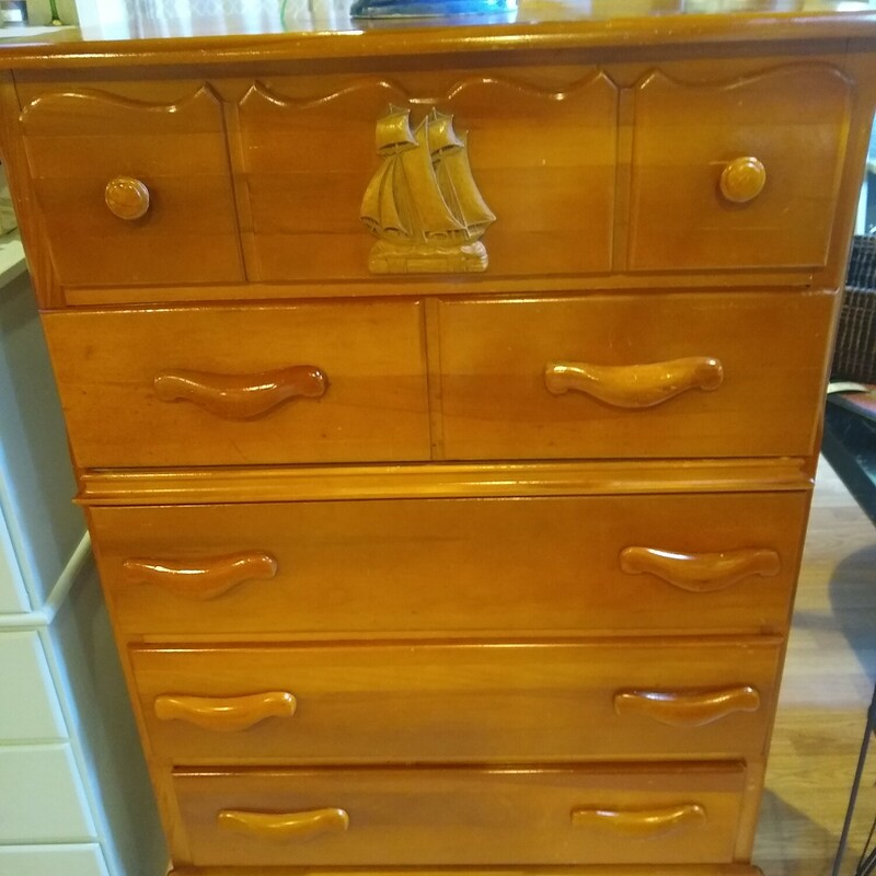 1950s Chest W/Ship Motif

1950s Maple chest with a raised ship on top drawer.
5 dove tailed drawers.

 Size: 31 in wide X 18 in deep X 48 in high