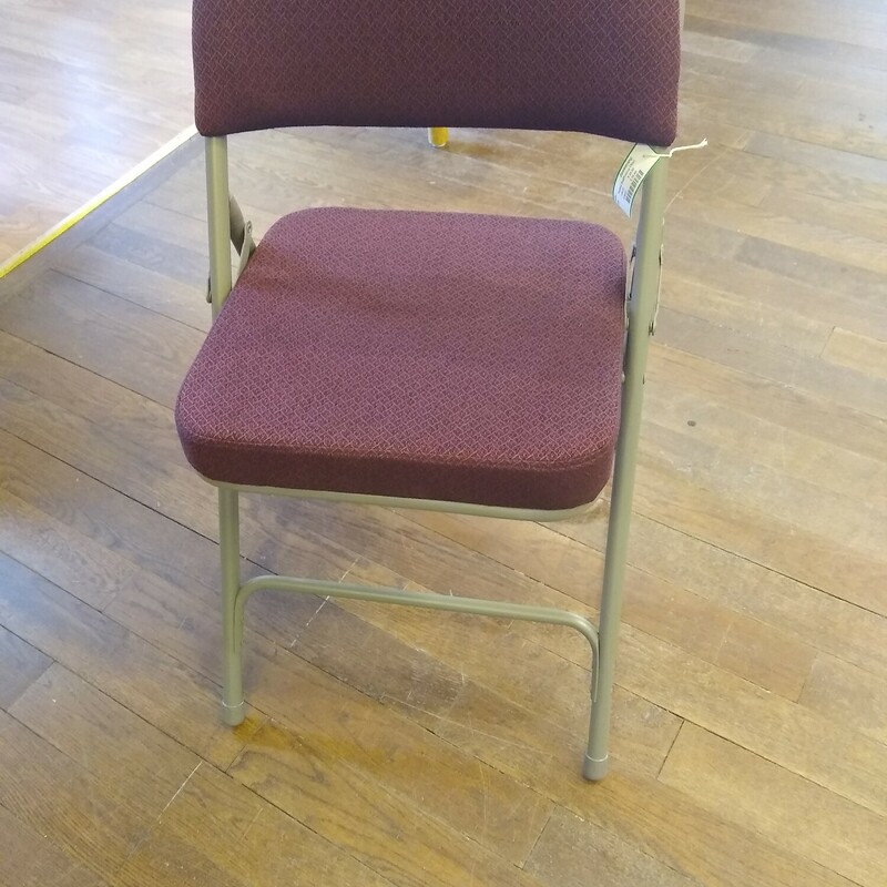 Padded SeatFolding Chair

Brand new metal folding chair with very pretty maroon color padded seat.  4 available in store and 4 more available from consignor.