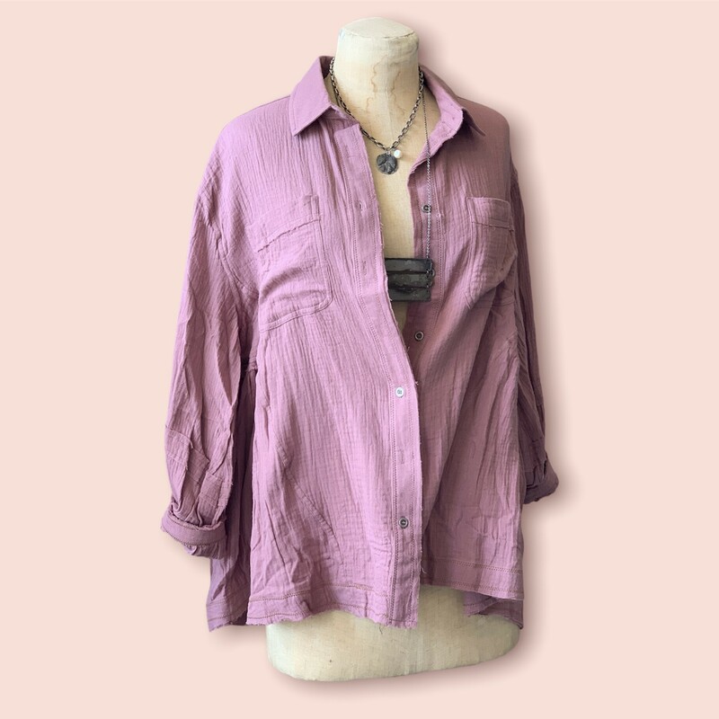 These gorgeous tops come in a lovely mauve color and are made of the very popular gauze material with frayed hems! This is a staple piece!