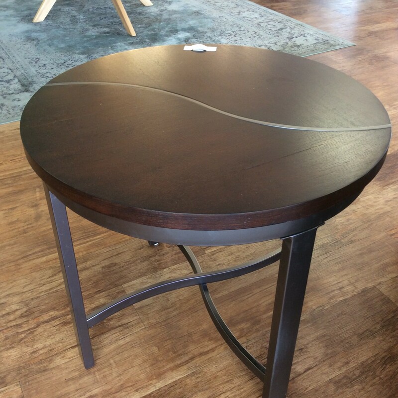 This pair of round contemporary end tables has an inlaid metal strip with matching metal bases.