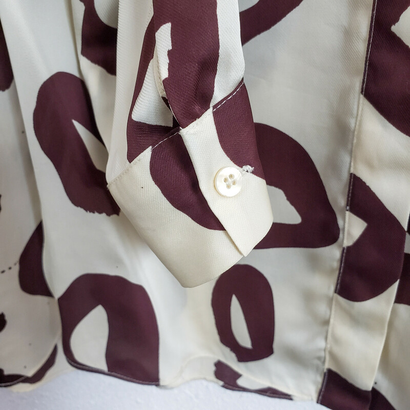Whistles<br />
Cream and brown print<br />
Size: 12