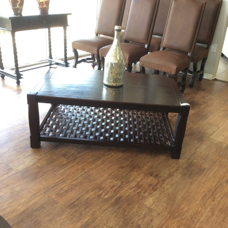 This is a dark brown, South Cone Leather Top Coffee Table.