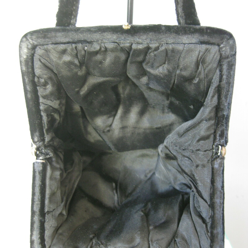 Antique Velvet Frame Clos, Black, Size: None<br />
Simple velvet evening purse in black velvet.<br />
Frame opens wide. Big enough to hold your phone and other essentials.<br />
Pretty squishy shape with gorgeous statement round tilt clasp , embossed with leaves.<br />
Two handles<br />
Faille lining<br />
Most phones will fit, mine is aobut 6x4 and it fits.<br />
Great condition with a bit of shine on the velvet handles.<br />
<br />
6.5 x 6.5 , unstructured, flat when empty<br />
<br />
Thanks for looking!<br />
#51103