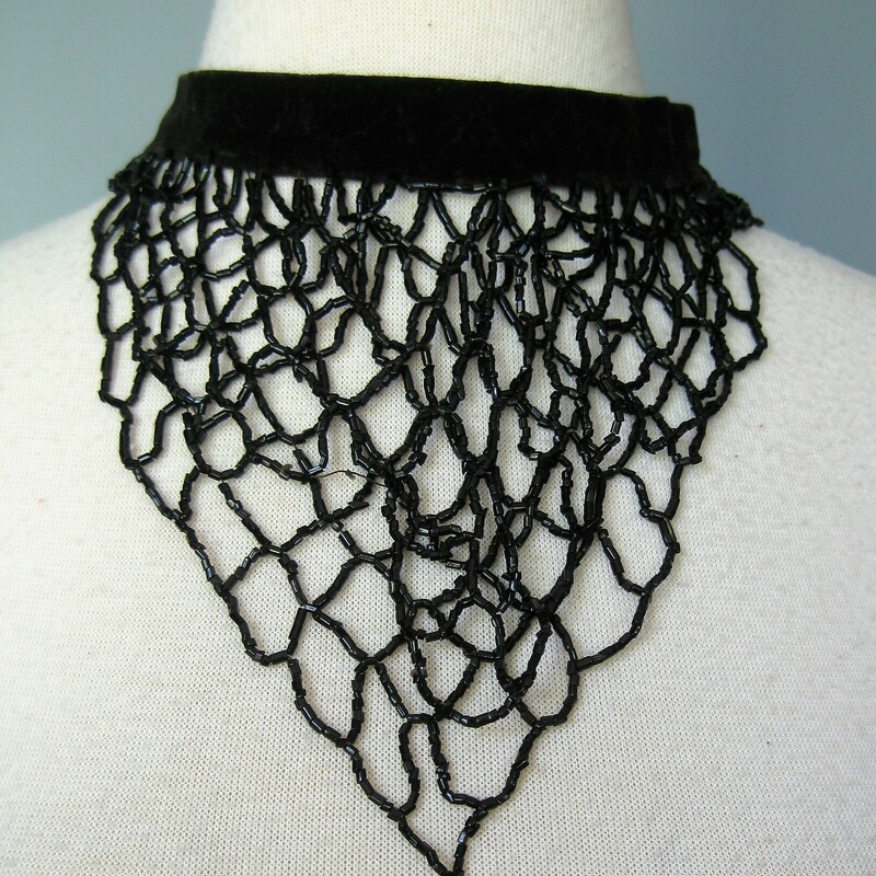 Antique Velvet Beaded Bib, Black, Size: None<br />
<br />
Victorian necklace made from velvet and jet beads.<br />
The velvet chokcer is dark brown, looks hand sewn and has two hook and eye sets as closures.<br />
The beaded bib section is two triangular layers of black jet beads.<br />
<br />
Quite old.  There is one segment that appears to have been repaird and is missing beads.  Please see all the photos.<br />
<br />
16 long<br />
<br />
<br />
thanks for looking!<br />
#50951