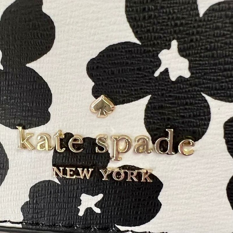KATE SPADE<br />
Darcy Small Slim Crossbody<br />
DETAILS<br />
5.5\" h x 7.8\" w x 1.5\" d<br />
Strap drop: 22\" drop when buckled at center hole<br />
Refined grain leather pvc<br />
Ksny metal pinmount logo<br />
Two way spade jacquard lining<br />
Interior: 3 credit card slots<br />
Exterior: 2 slip pockets on each side of crossbody<br />
Zip closure<br />
This bag is brand new, original paper in the ba and wrapped around straps.<br />
no marks or flaws.<br />
Original retail Price: $249.00