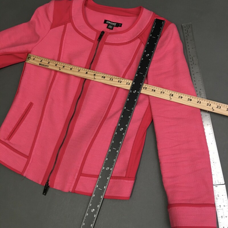 DKNY, Hot Pink, Size: 6<br />
<br />
Collarless, zip up / dwn closure,  long sleeved pink moto style jacket from DKNY. Lined. Textured pink linen blend material with darker pink smooth crisp cotton color panels and piping details<br />
Skirt zips and hook back closure, falls above the knee, flat back pockets and wide waist band.<br />
Sold as set.<br />
skirt 8.9 oz<br />
jacket 1 lb 3 oz