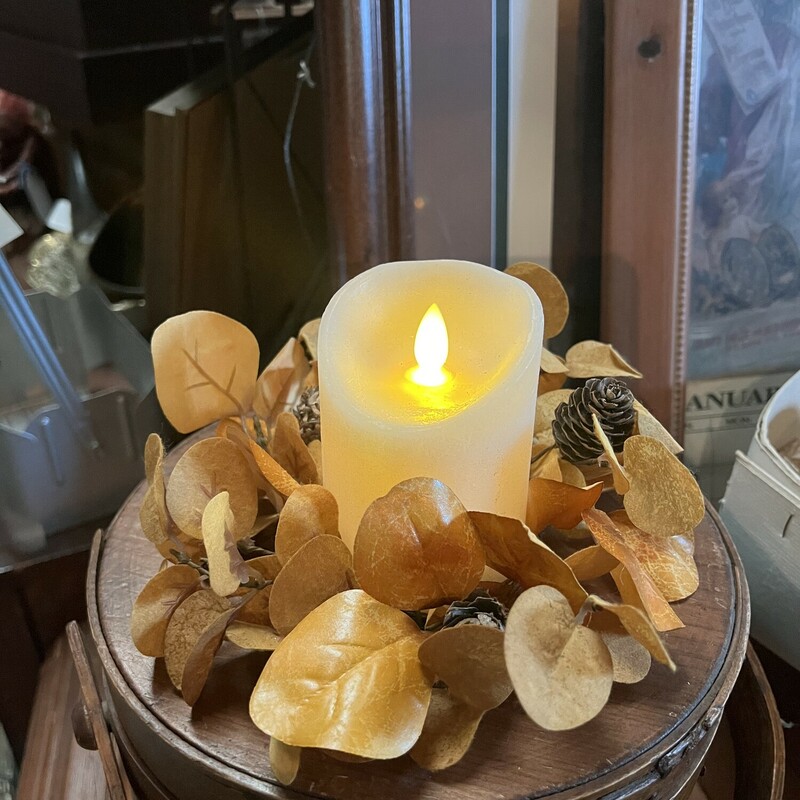 This pretty Mustard Eucalytus Candle Ring has fabric leaves with mini pinecones. Its cozy mustard hue makes it a perfect addition to your fall decor.<br />
Ring measures 9 inches outside; 3 and a half inside<br />
Our small Bridgwater (inventory number 12816) candle fits perfect with this ring