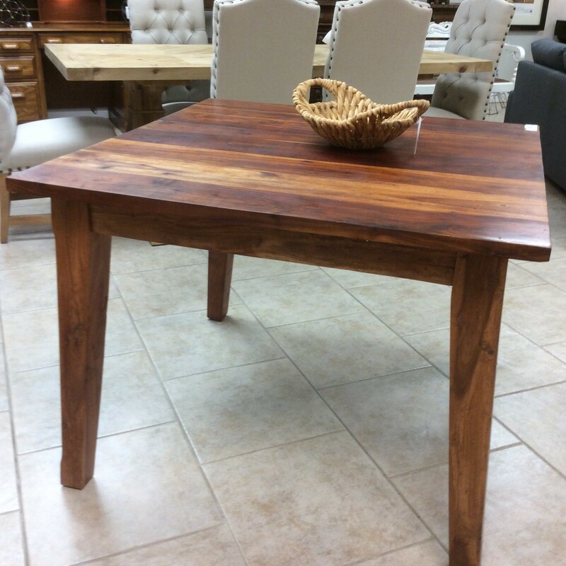 This square Rosewood table has clean simple lines with beautifully grained wood. Very versatile piece.