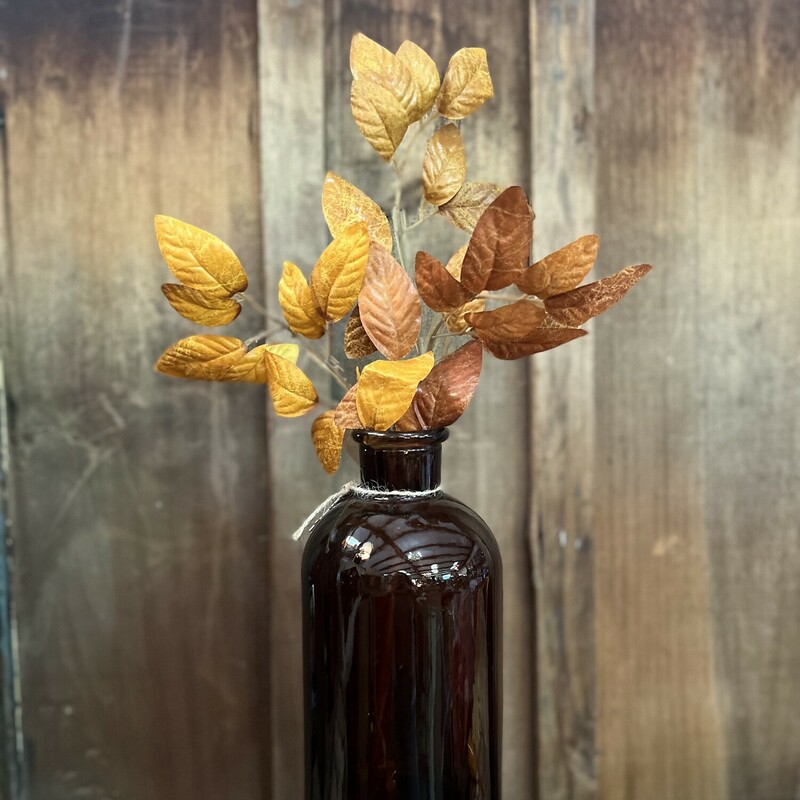 This gorgeous leaved stem has gold and rust tones and measures 18 inches in length! These beautiful leaves take any empty vase to the next level and add a pop of color to any space!