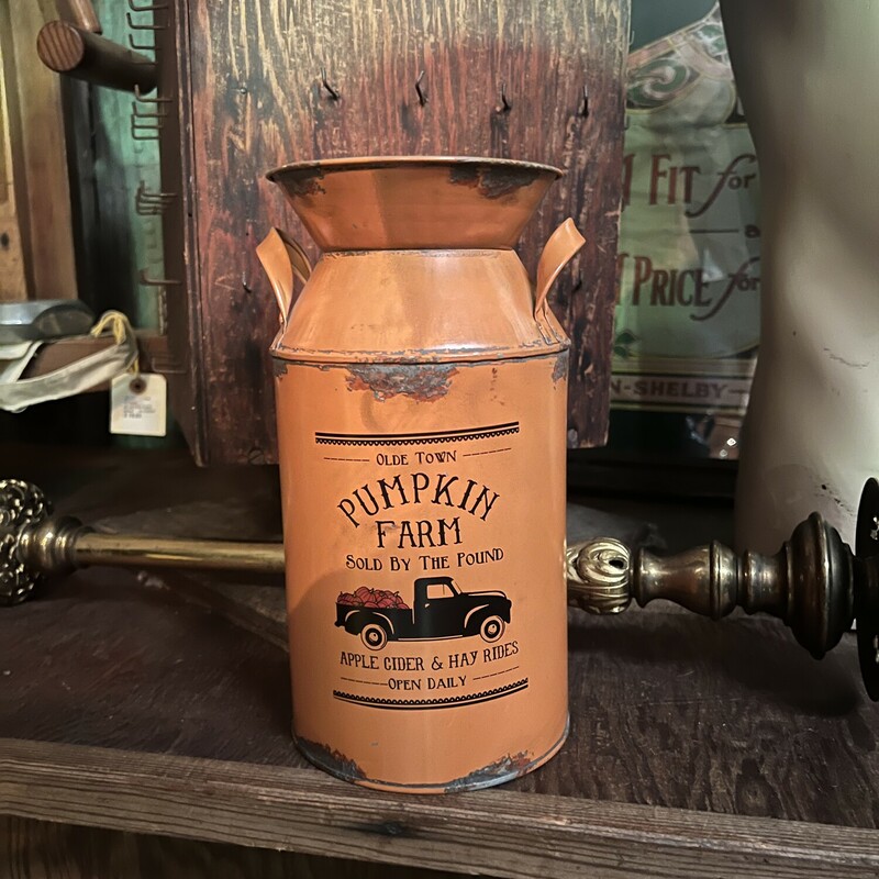 These distressed, orange milk cans are absolutely adorable! These cans are gorgeous filled with fall florals!
The front reads, Olde Town Pumpkin Farm Sold By The Pound Apple Cider & Hay Rides Open Daily.