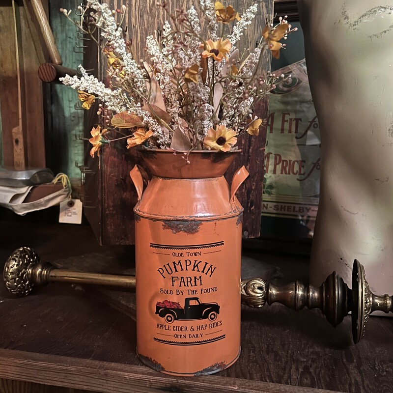 These distressed, orange milk cans are absolutely adorable! These cans are gorgeous filled with fall florals!
The front reads, Olde Town Pumpkin Farm Sold By The Pound Apple Cider & Hay Rides Open Daily.
