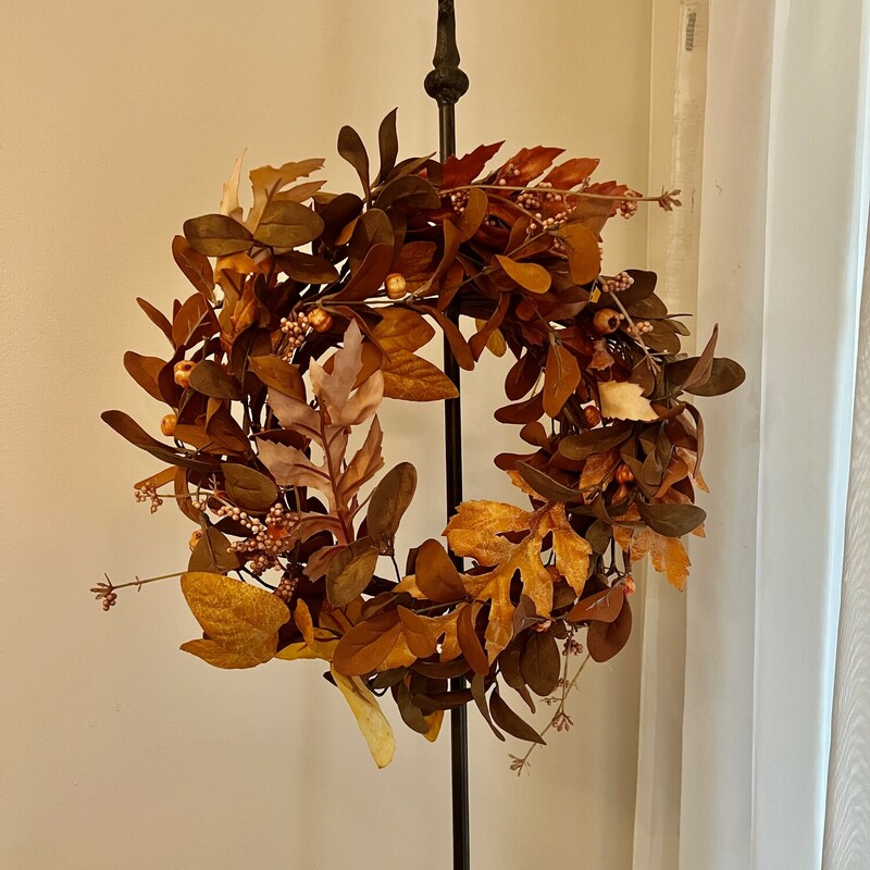 These gorgeous wreaths are a mix of orange and brown leaves with foam berry clusters! These wreaths measure 12 inches in diameter.