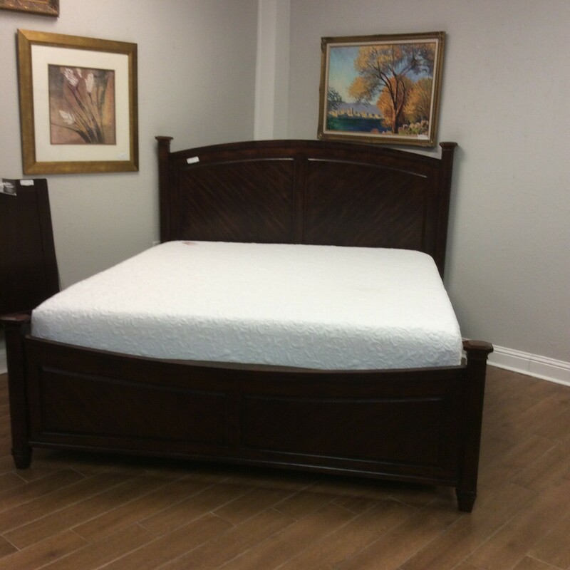 This king size paneled Headboard/Footboard/Rails is done in a dark cherry finish.