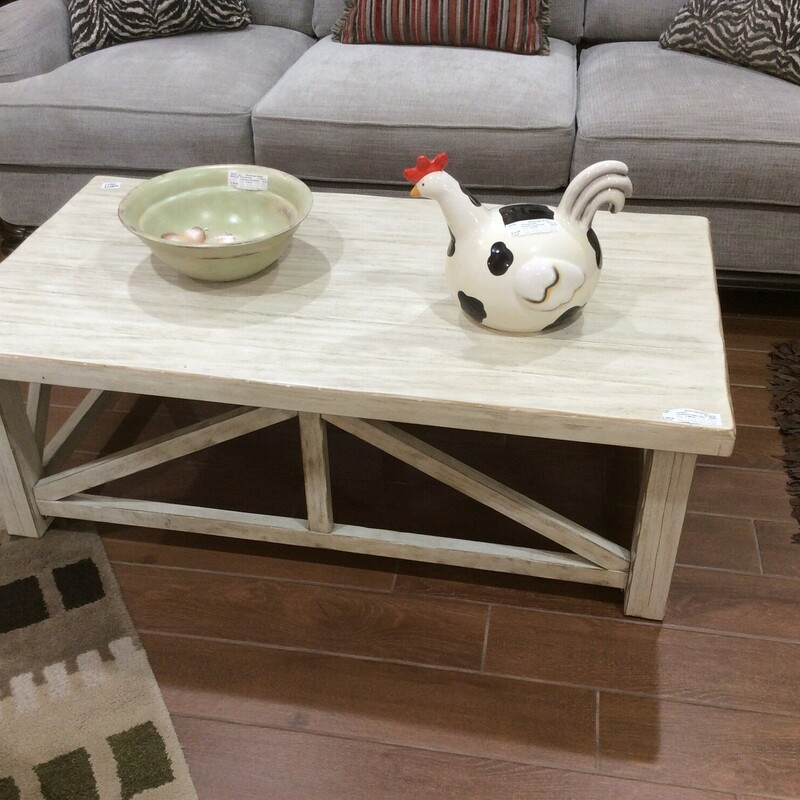 This is a beautiful white, distressed farmhouse coffee table.
