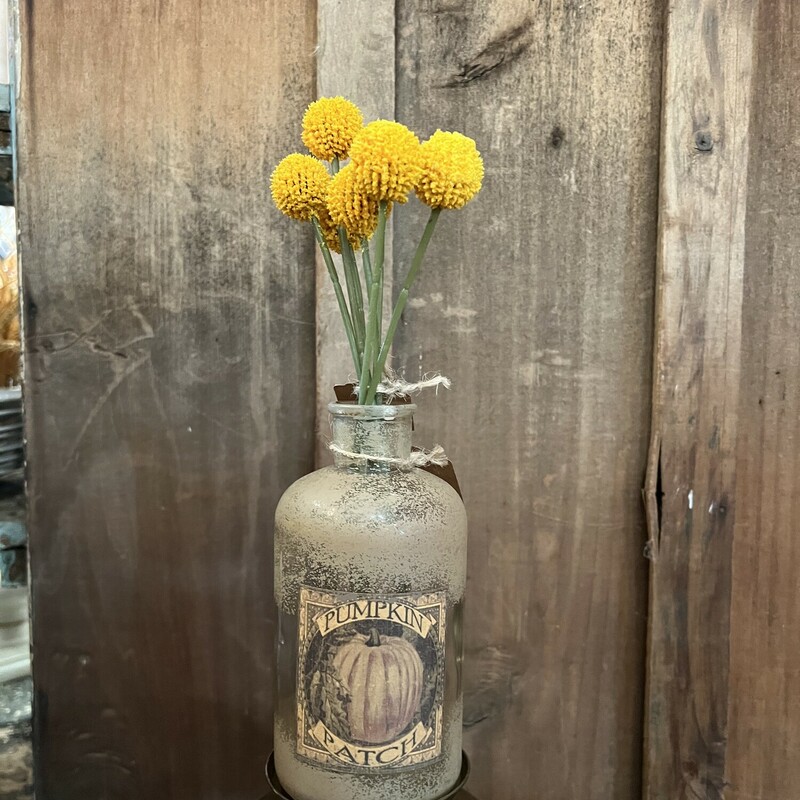 Yellow Billy Button Bouquet  is a plastic floral that has long and slender green plastic stems. Bouquet is bound together by a raffia band and its stem is flexible for desired adjustments. It looks great in a pitcher, can,or vase. Measures 10 inches high
