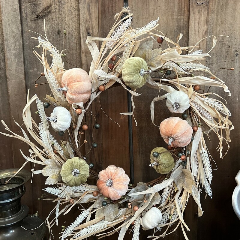 Beautiful and classy velvet pumpin wreath has velvet pumpkins in green, light orange and white. Wreath also has raffia, berries and plastic wheat stems and would look gorgeous on your door or on one of our wreath stands
Wreath measures 18 inches diameter and 10 inches inner.