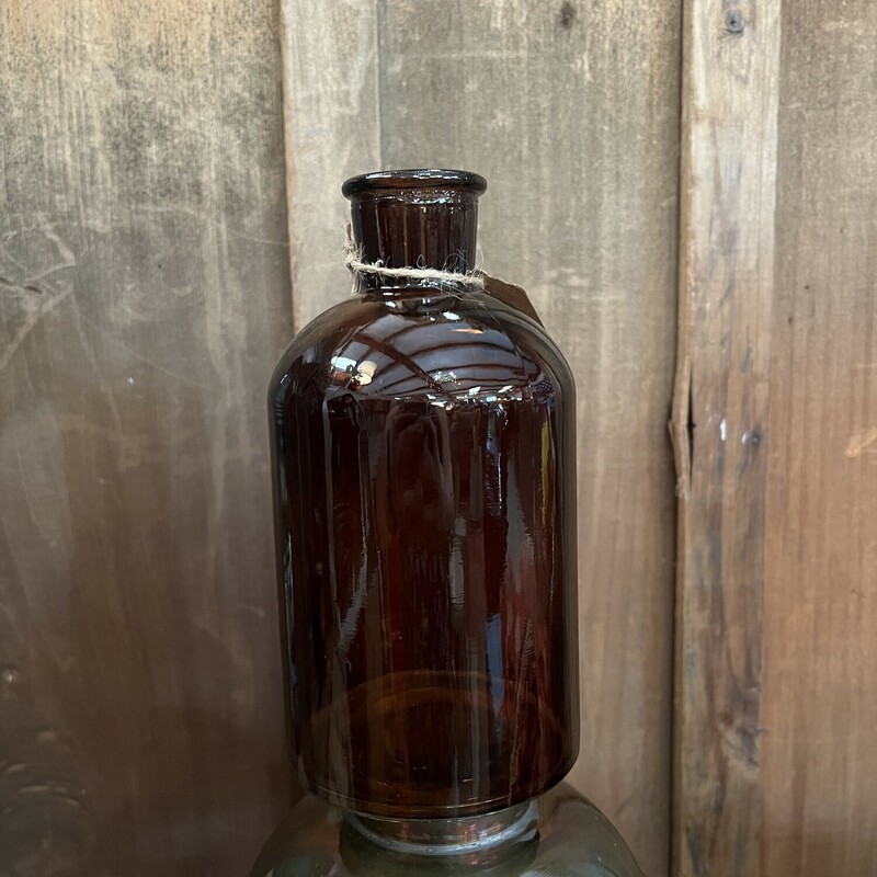 Small amber bottle measures measure 8 inches tall and looks beautiful with seasonl florals